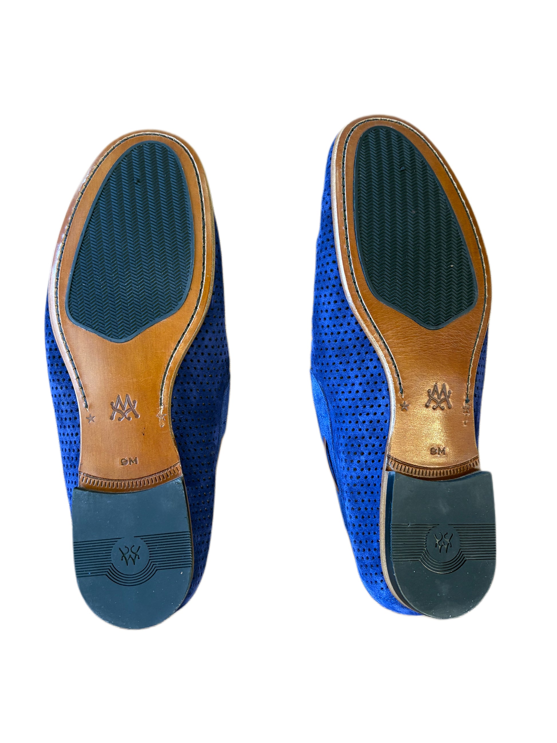 Bottom view of a pair of Mezlan Tarraco Loafer blue perforated suede dress shoes by Mezlan, featuring leather soles and rubber heel caps, displayed on a white background.