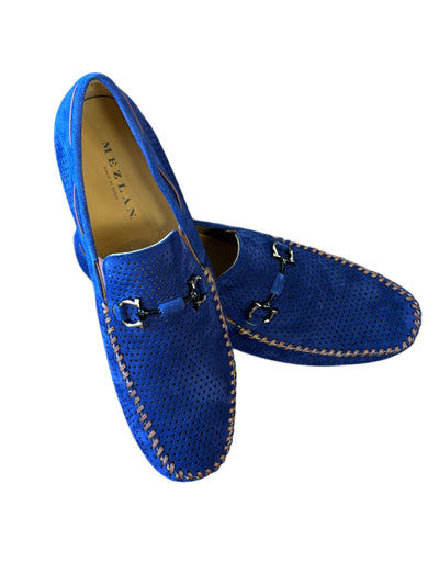 The Mezlan Tarraco Loafer for men features blue perforated suede, a moc toe design, beige stitching, and metal horsebit accents. Displayed on a white background.
