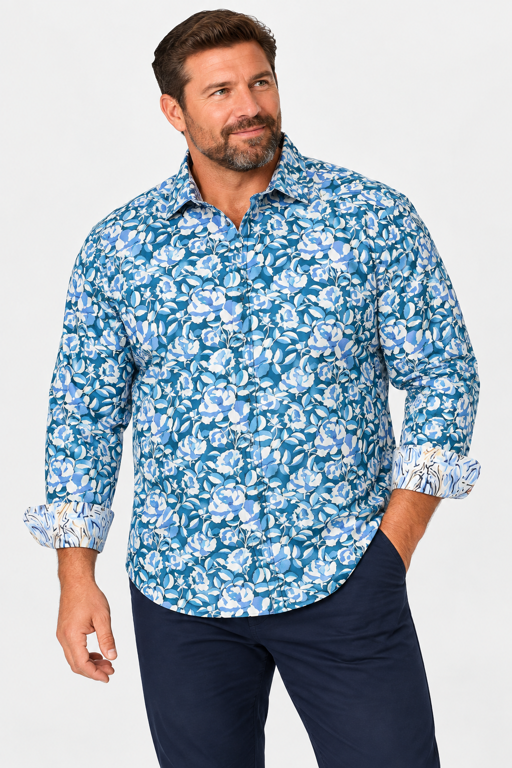 Man wearing the Robert Graham Euclid Long Sleeve Shirt Big & Tall in blue and white floral pattern, paired with navy pants, against a plain background.