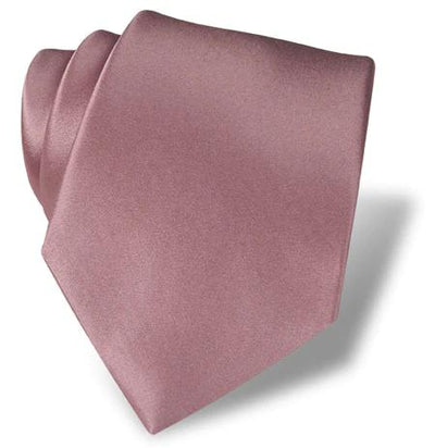 The DION Solid Silk Tie by Dion, in solid dusty rose pink, is neatly folded and displayed on a white background with a slight shadow—a perfect formal accessory for Toronto style.