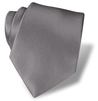 The DION Solid Silk Tie by Dion, shown rolled on a white background, features smooth gray silk with a satin-like finish—an ideal formal accessory in Toronto.