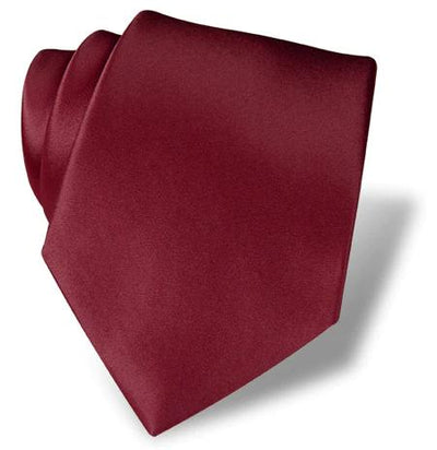 The DION Solid Silk Tie by Dion, shown neatly folded in burgundy on a white background, is an essential accessory for formal wear in Toronto.