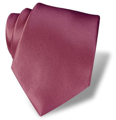 The Dion Solid Silk Tie, shown in rich burgundy silk against a white backdrop, is an elegant accessory to elevate your formal wear in Toronto or anywhere else.