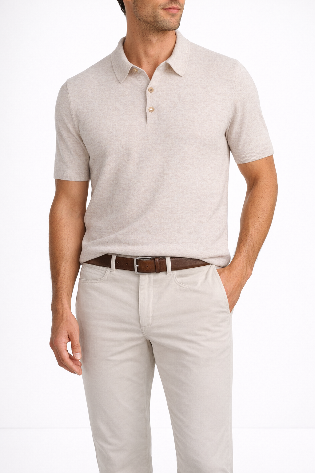 Man wearing a light gray polo shirt and beige pants on a white background