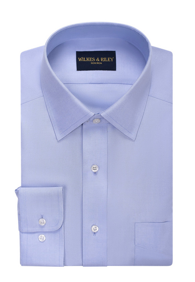 A light blue, long-sleeve Wilkes & Riley Solid Dress Shirt with a spread collar and tailored fit, featuring Supima cotton that's non-iron for all-day wrinkle-free wear. Includes a front pocket, button cuffs, and label on the inside collar.