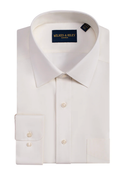 A folded Wilkes & Riley Solid Spread Collar Dress Shirt Classic Fit in white, with long sleeves, a front pocket, buttoned cuffs, and the brand label inside the collar.