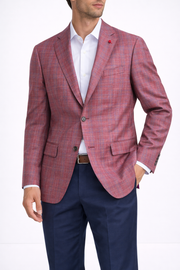 A man models the TailoRed Gilmore Sport Coat 8130538 over a white dress shirt with navy blue trousers and a brown belt, standing against a plain background.