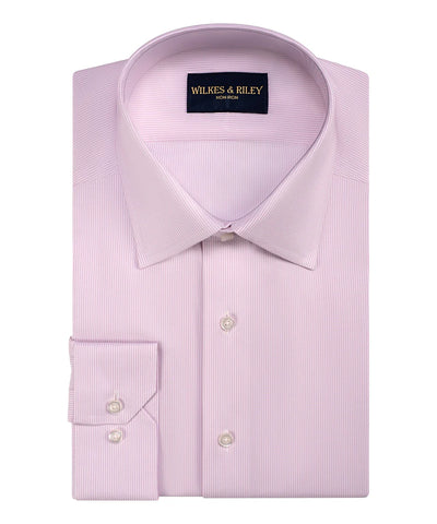A neatly folded Wilkes & Riley Twill Stripe Dress Shirt in light pink Supima cotton, featuring a pointed collar, buttoned cuffs, and the Wilkes & Riley label inside the collar.