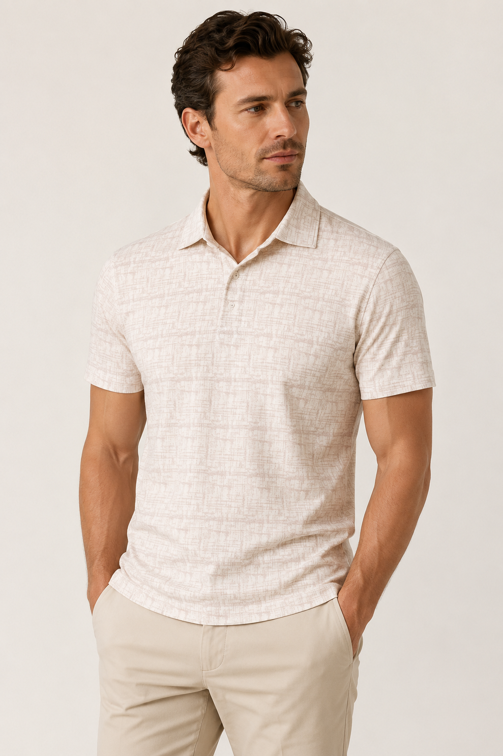 Man wearing a Luchiano Visconti Visconti Short Sleeve Printed Polo MORL3P54 with 4-way stretch knit and tan pants, hands in pockets, looking to the side against a plain background.