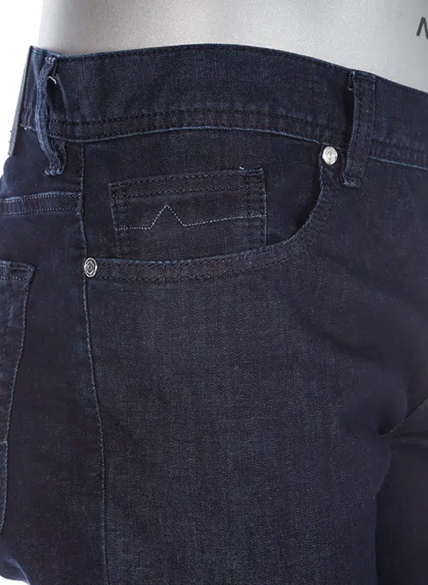 Close-up of dark blue jeans with a focus on the back pocket and stitching.