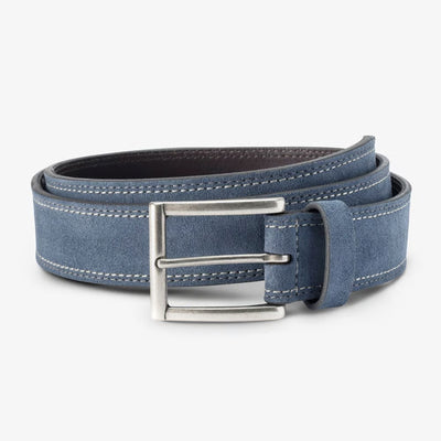 The Allen Edmonds Bourbon Street Suede Belt by Allen Edmonds is a rolled-up blue European suede dress belt featuring white stitching and a silver rectangular buckle, handcrafted in America and displayed against a plain light background.