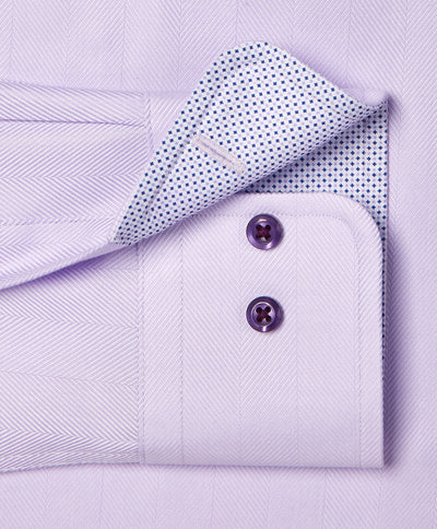 Close-up of the David Donahue Contrast Herringbone Solid Dress Shirt TBMS13100 cuff with two purple buttons and a white inner lining featuring small blue dots.