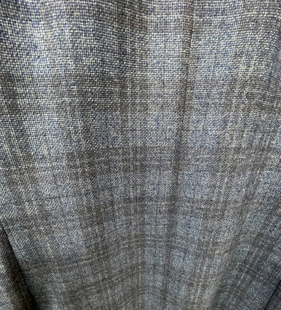 Close-up of a gray woven fabric with a subtle windowpane pattern and slight texture, perfect for the Jack Victor Sport Coat 1252227 by Jack Victor.