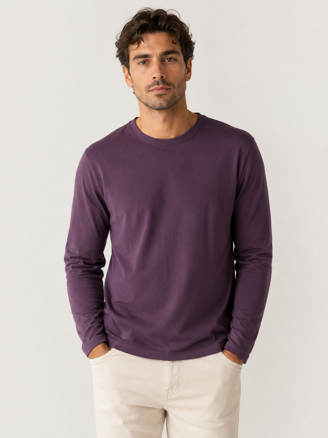 A man wearing the Robert Barakett High Crew Long Sleeve RB82247 in purple and light-colored pants stands with his hands in his pockets against a plain background.