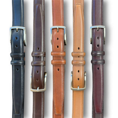 Five Torino Italian Burnished Kipskin Leather Belts in black, dark brown, tan, light brown, and burgundy are arranged vertically side by side against a white background.
