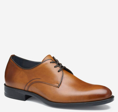 The Johnston & Murphy Flynch Plain is a single brown leather dress shoe with Italian hand-stained uppers, black laces, leather linings, and a low black heel from Johnston Murphy, displayed on a white background.
