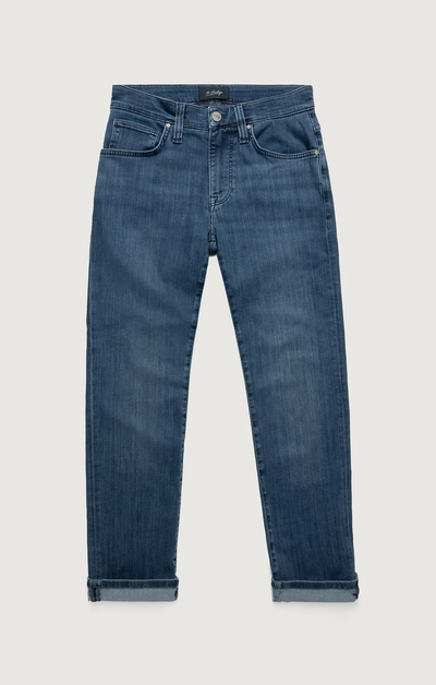 34 Heritage Charisma Mid Urban jeans by 34 Heritage, crafted from premium stretch denim in blue, feature a straight leg, rolled cuffs, front pockets, and a button closure laid flat on a light background.