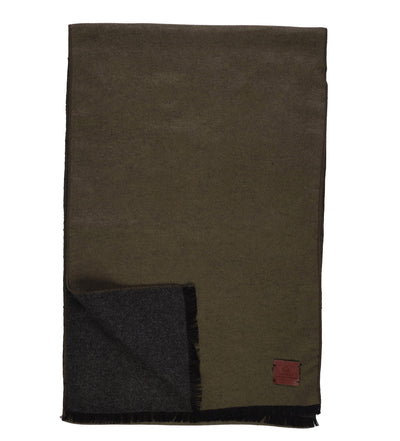 The Amanda Christensen Double Face Scarf 440714 features olive green and dark gray wool, elegant fringed edges, and a small brown leather patch in one corner.