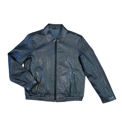 The Marcello Redondo Leather Jacket J-233 by Marcello features black nappa leather, a front zipper, two zippered side pockets, classic collar, and a subtle laser-cut geometric pattern for modern sophistication.