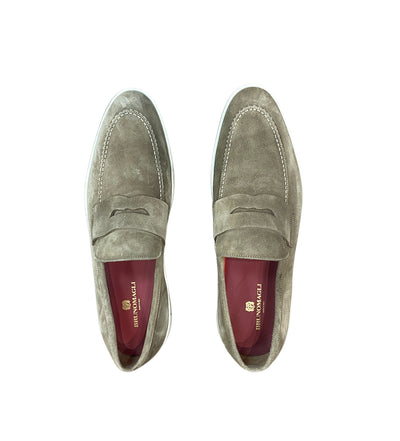 The Bruno Magli Prato Slip On Loafers feature light brown suede, white stitching, a penny strap, red insoles, and classic Bruno Magli design, shown here in an overhead view.