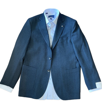 The Jack Victor Sport Coat 1252209, featuring a dark blue herringbone pattern, is displayed flat over a white collared dress shirt on a white background.