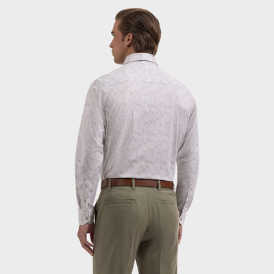 A man wearing a Bugatchi James Feather Print Sport Shirt (style KF9234K60), featuring long sleeves and a light feather pattern, along with olive green trousers, stands facing away from the camera against a plain background.
