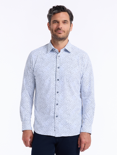 A man wears the Robert Graham Montagu Knit Sport Shirt Big & Tall by Robert Graham in light blue with a geometric lattice print, paired with dark pants, standing facing forward against a plain white background.