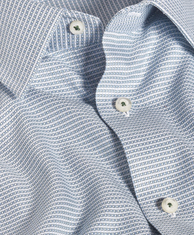 Close-up of a David Donahue Green & Sky Micro Dobby Dress Shirt TBSP13002, highlighting the micro dobby weave, white buttons, collar, and shirt front.