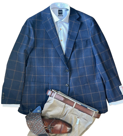 The Byron Luca Sport Coat Windowpane 9540 by Byron, paired with a light blue checked shirt, beige trousers, brown polka dot socks, brown leather shoes, and a brown belt, is arranged flat on a white background.