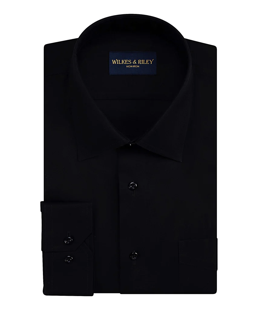 A neatly folded Wilkes & Riley Black F9999 poplin dress shirt with a spread collar and buttoned cuffs, featuring the Wilkes & Riley brand label inside the collar.