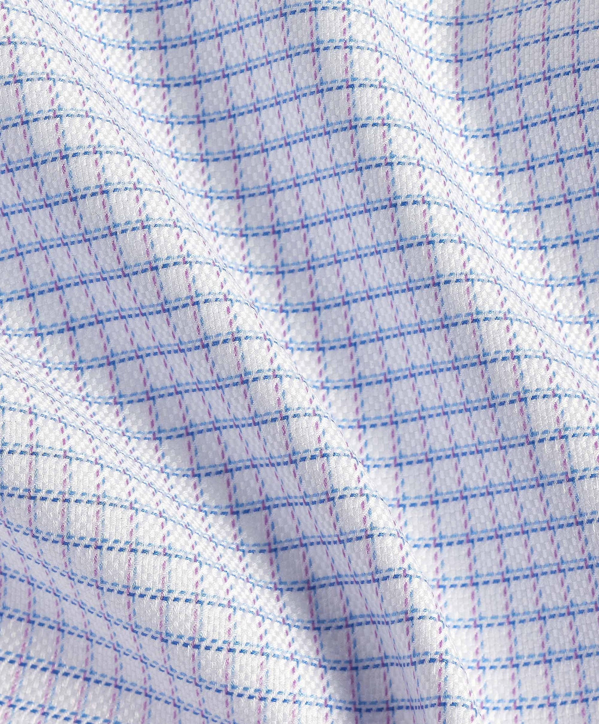 Close-up of a David Donahue OP Check Dress Shirt TBSP12821144, featuring white Pima cotton with blue and pink grid lines, highlighting its texture and gentle folds.