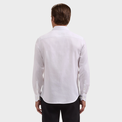 A man is shown from the back against a plain light background, wearing a Bugatchi Julian Tonal Geometric Jacquard Shirt (KS4001L3S) in white and black pants.