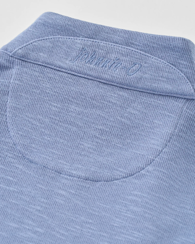 Close-up of a blue Johnnie-O Flame Stitch 1/4 Zip Sweater Big & Tall, featuring a stitched brand logo on the back neck yoke.