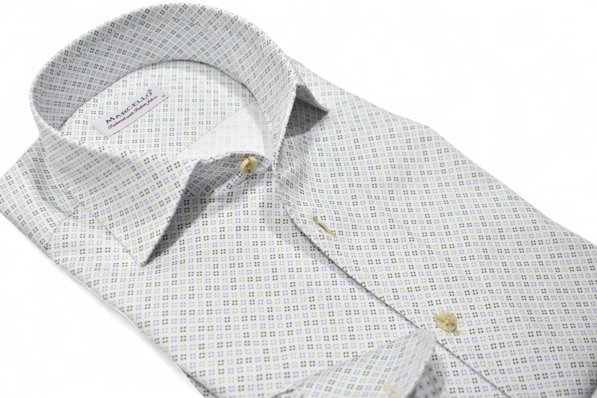 The Marcello OP Colored Bracket Medallion Sport Shirt W104 is a long-sleeve cotton sateen shirt by Marcello, featuring a blue and tan geometric pattern on white, with a classic one-piece collar and tan buttons.