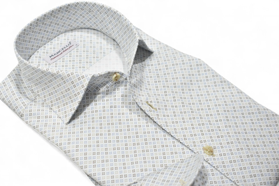 The Marcello OP Colored Bracket Medallion Sport Shirt W104 is a long-sleeve cotton sateen shirt by Marcello, featuring a blue and tan geometric pattern on white, with a classic one-piece collar and tan buttons.