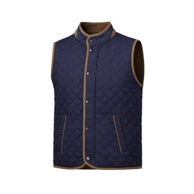 The F/X Fusion Upland Quilted Vest Big & Tall 13009 by F/X Fusion features a navy blue quilted design with brown trim, sleeveless construction, snap button closure, and two front pockets. Displayed on a plain white background, this lightweight men’s vest is ideal for easy layering and everyday comfort.
