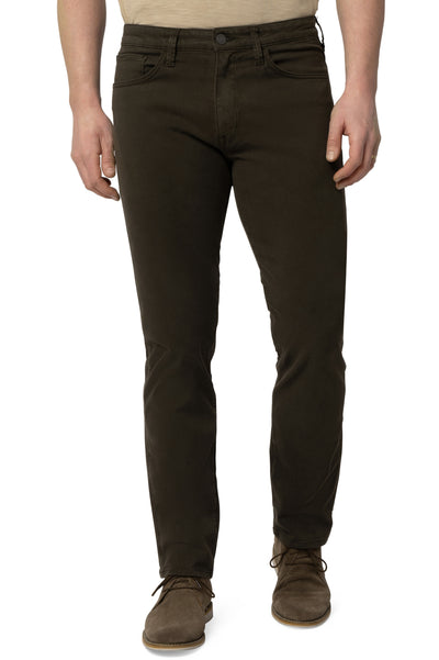 A person wearing 34 Heritage Courage Twill Straight Leg Pants in cactus green, paired with a beige shirt and brown suede shoes, stands against a white background.