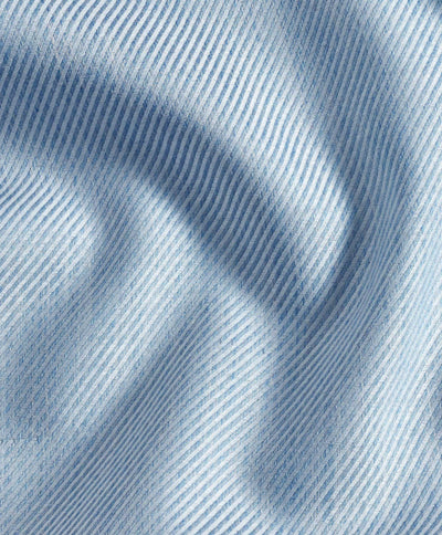 Close-up of light blue cashmere blend fabric with diagonal ribbed texture and soft folds—luxurious material from the David Donahue Cashmere Blend Shirt CBSM11101.
