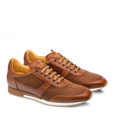 The Mezlan Maxim Dress Sneaker by Mezlan features brown leather, embossed suede side panels, tan laces and interiors, white midsoles, and is handmade in Spain. Shown on a white background.