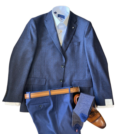 Navy blue suit with a light patterned shirt, matching trousers, and a Jack Victor Plaid Sport Coat 1252106, paired with a brown leather belt, blue socks, and brown leather dress shoes arranged on a white background.