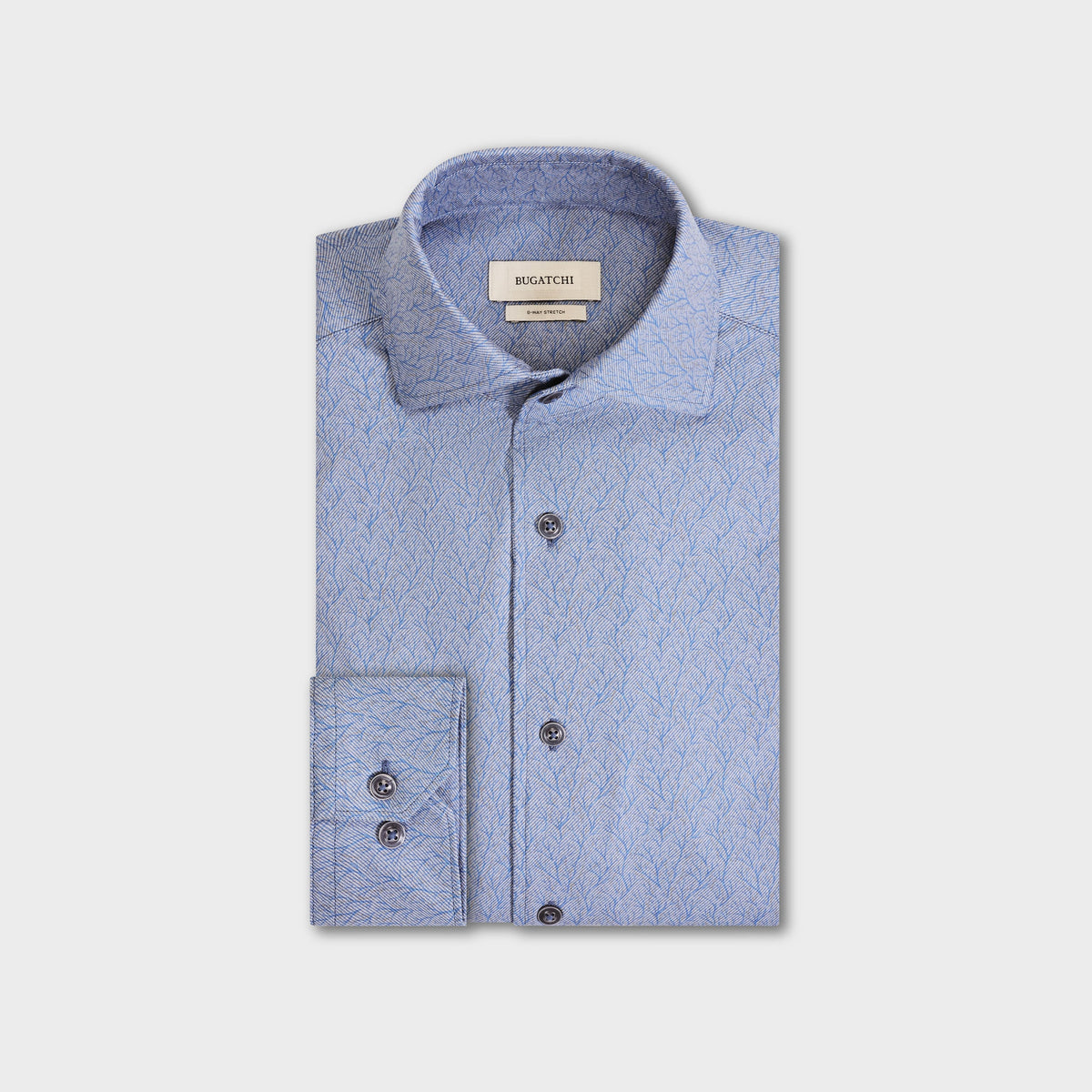 Light blue long-sleeve Bugatchi Devon Foliage Print Sport Shirt (KF9423K80) with a subtle leafy pattern, folded neatly. The Bugatchi brand label is visible on the inner collar. This wrinkle-resistant shirt blends style and practicality for a polished look all day.