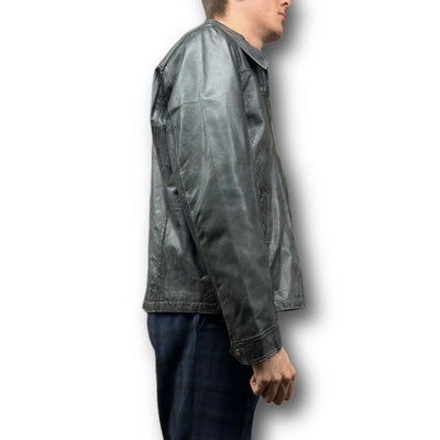 A person in profile wears the Missani Vintage Leather Jacket 392794 with plaid pants against a white background.