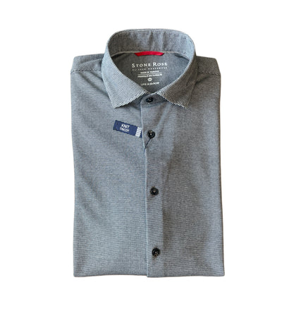 The Stone Rose LS T-Series 2K7T152, a gray long sleeve shirt neatly folded with a blue "Print Model" tag on its left side, features DryTouch technology for enhanced comfort and breathability.