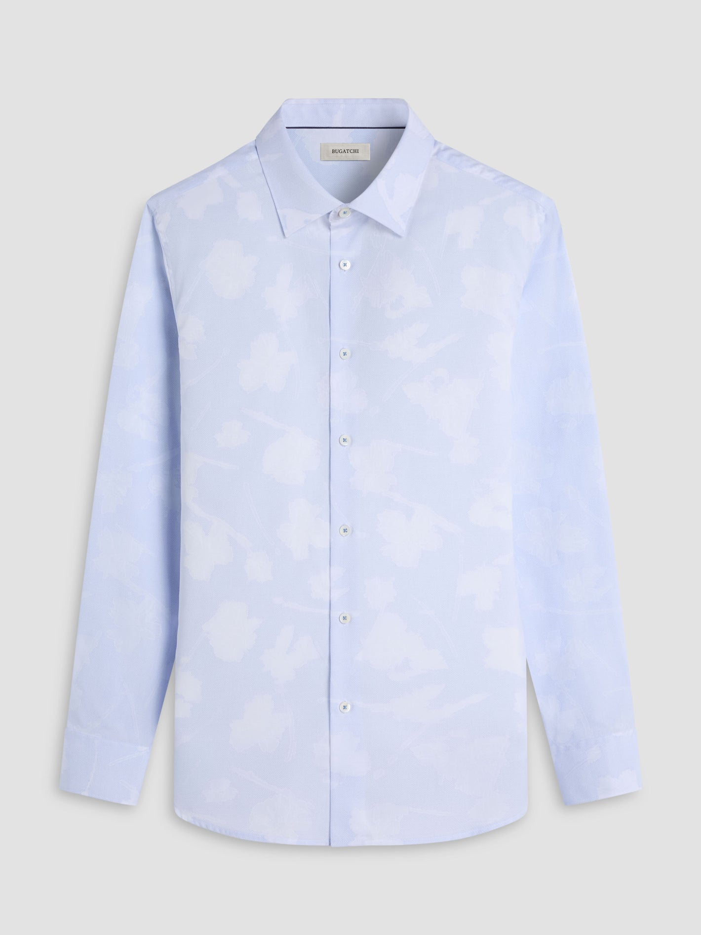 Bugatchi LS Julian GS3087L3S Blue by Bugatchi: a light blue long-sleeve button-up shirt in premium Italian fabric with a subtle white abstract pattern, shown on a plain grey background—ideal for refined menswear collections.