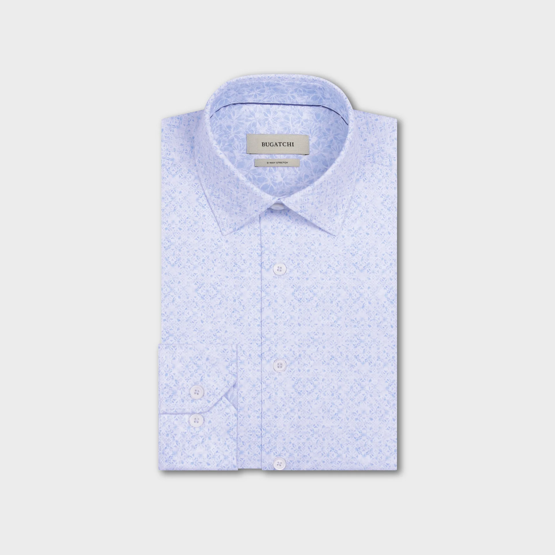 The Bugatchi OP Jimmy OoohCotton® Floral Shirt JF9635K61 is a light blue patterned performance shirt with a front pocket and buttoned cuffs, neatly folded and displayed on a plain white background.