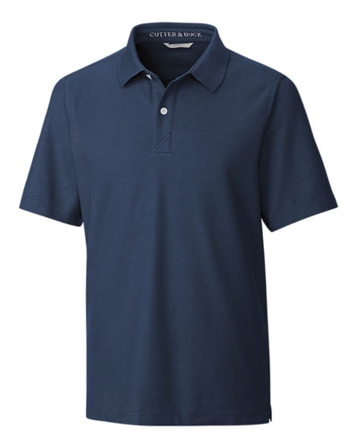 The Cutter & Buck Breakthrough Polo Big & Tall is a navy blue, short-sleeve, collared shirt with a two-button placket, made from moisture-wicking fabric by Cutter & Buck, shown on a plain white background.