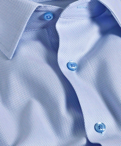 Close-up of the David Donahue Micro Tic Dress Shirt TBSP11011, featuring textured Pima cotton, collar detail, and three blue buttons.