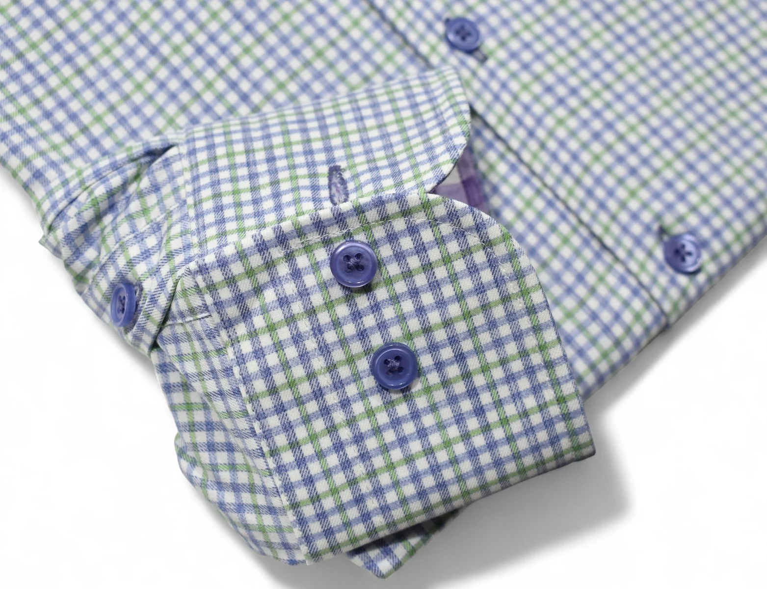 A close-up of the Marcello OP Plum/Green Plaid Sport Shirt DS122 shows its soft cotton cuff, green and blue plaid pattern, and three blue buttons.