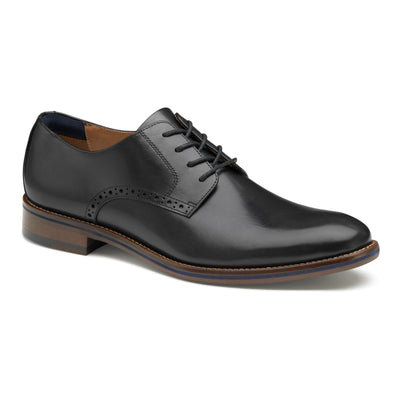 The Johnston & Murphy Conard 2.0 Plain is a black full grain leather lace-up dress shoe featuring a low heel, cushioned footbed, and decorative side perforations.