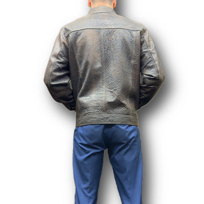 A man stands with his back to the camera, wearing a Missani Big & Tall Leather Jacket 394167 in dark brown and blue pants against a white background.